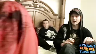 Muscular bald dude lays on the bed and pulls on his penis