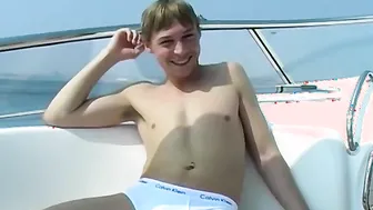 Blond British twink Timmy B does an interview and jerks off